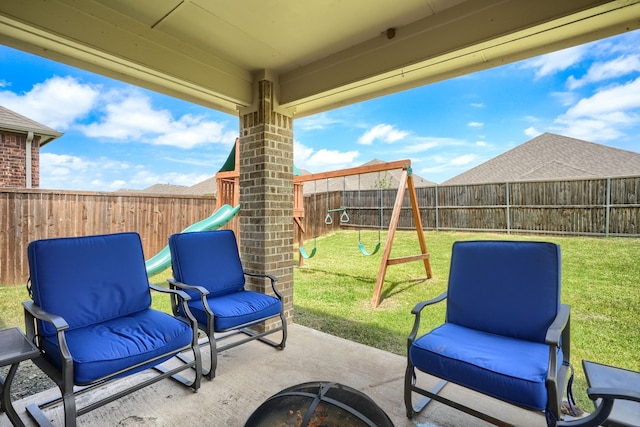 5604 Durst Ln, Forney, TX 75126 - fenced backyard featuring a playground and a patio area