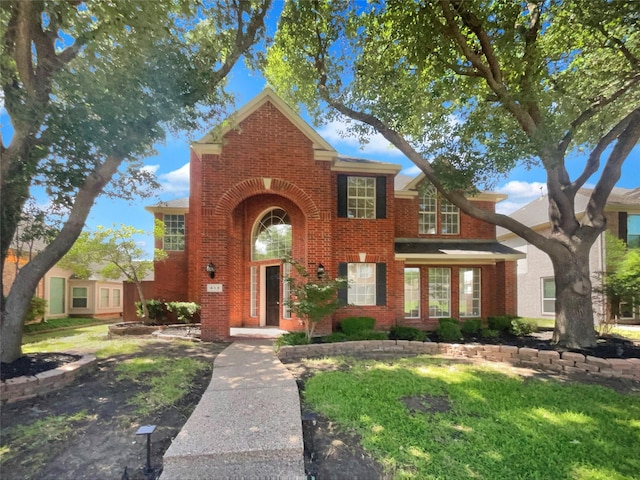 413 Thunderbrook Rd, Garland, TX 75044 - traditional-style home with brick siding and a front lawn