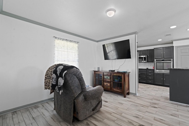 2600 Dave Angel Rd, Burleson, TX 76028 - sitting room with light wood-style flooring, ornamental molding, and recessed lighting
