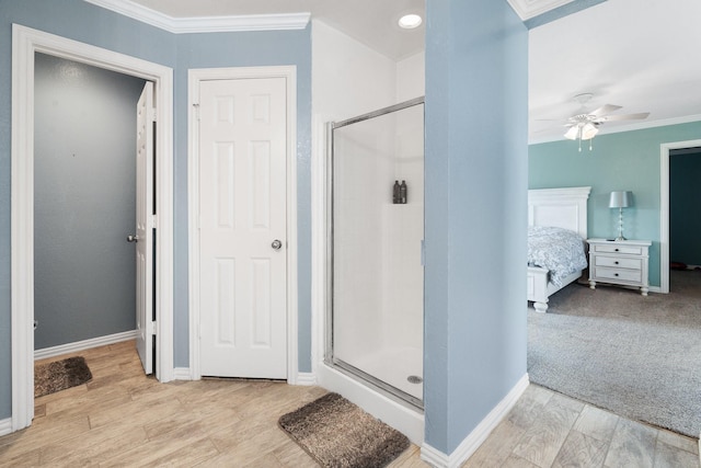 2600 Dave Angel Rd, Burleson, TX 76028 - ensuite bathroom featuring a stall shower, crown molding, a ceiling fan, and wood finished floors