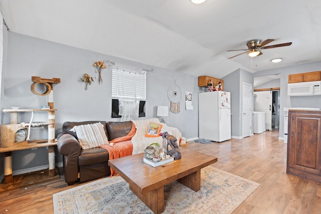 2600 Dave Angel Rd, Burleson, TX 76028 - living room featuring washer / clothes dryer, ceiling fan, lofted ceiling, and light wood-type flooring