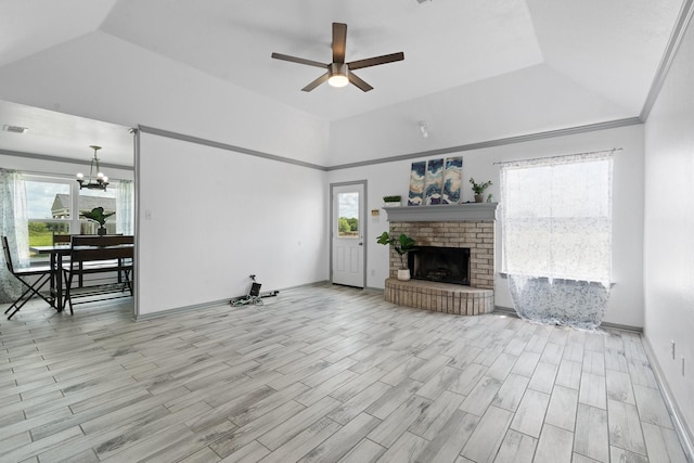 2600 Dave Angel Rd, Burleson, TX 76028 - unfurnished living room featuring a ceiling fan, a chandelier, a brick fireplace, a raised ceiling, and wood finished floors