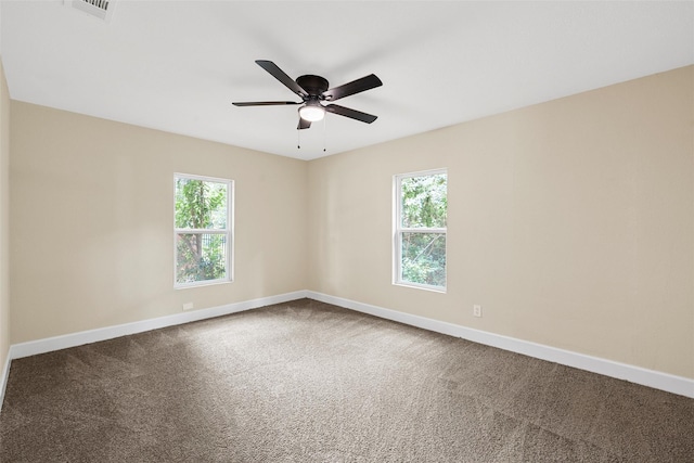 1024 N 45th St, Waco, TX 76710 - carpeted empty room featuring plenty of natural light, baseboards, and a ceiling fan