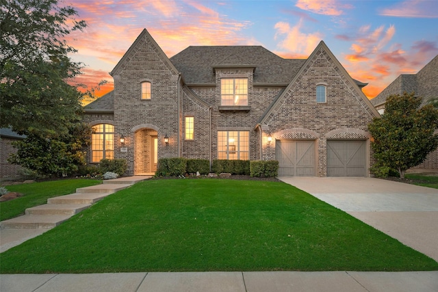 4301 Fisher Rd, Prosper, TX 75078 - view of front facade with brick siding, a lawn, concrete driveway, and a garage
