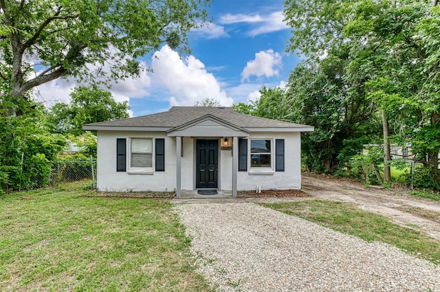 9229 S Dodson Dr, White Settlement, TX 76108 - bungalow-style home featuring stucco siding, gravel driveway, and roof with shingles