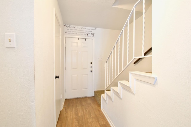 832 N 62nd St, Waco, TX 76710 - foyer with wood finished floors, stairway, and baseboards
