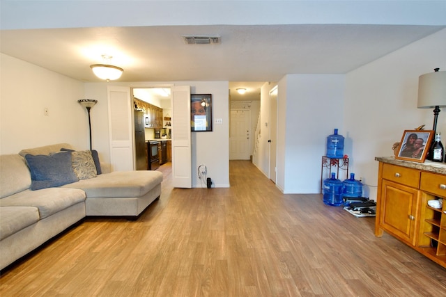 832 N 62nd St, Waco, TX 76710 - living area featuring light wood-style floors and baseboards
