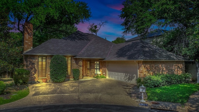 4708 Shady Ridge Ct, Fort Worth, TX 76109 - view of front of property with an attached garage, concrete driveway, a chimney, brick siding, and a shingled roof