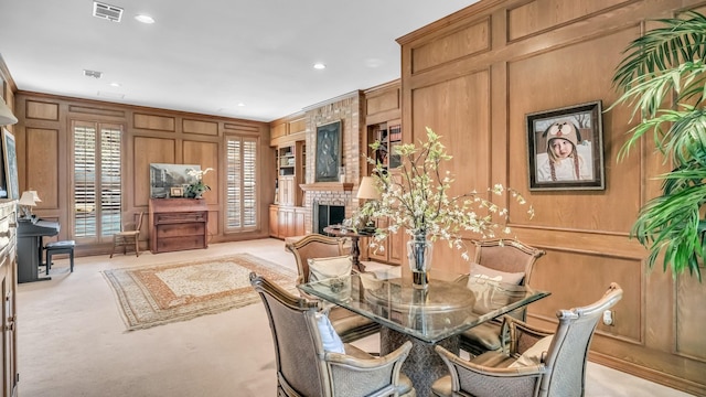 4708 Shady Ridge Ct, Fort Worth, TX 76109 - dining space featuring a decorative wall, wooden walls, carpet, recessed lighting, and a fireplace
