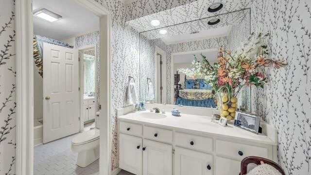 4708 Shady Ridge Ct, Fort Worth, TX 76109 - bathroom with wallpapered walls, toilet, and vanity