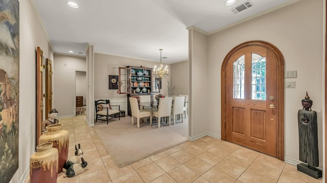 4708 Shady Ridge Ct, Fort Worth, TX 76109 - foyer featuring light tile patterned flooring, ornamental molding, light carpet, recessed lighting, and a chandelier