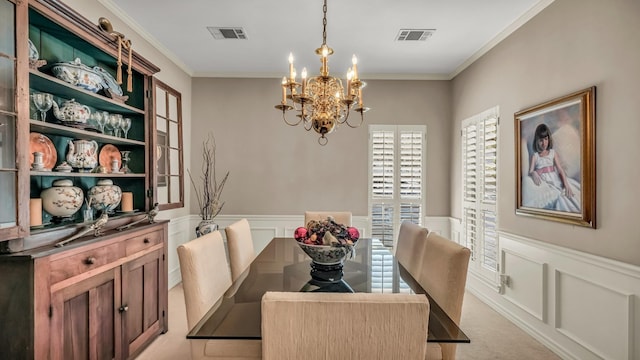 4708 Shady Ridge Ct, Fort Worth, TX 76109 - dining room featuring a chandelier, crown molding, a decorative wall, wainscoting, and light carpet