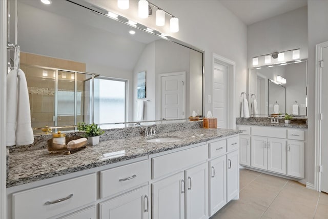 2451 S Gate Dr, Richardson, TX 75080 - bathroom featuring vanity, a shower stall, tile patterned flooring, and lofted ceiling