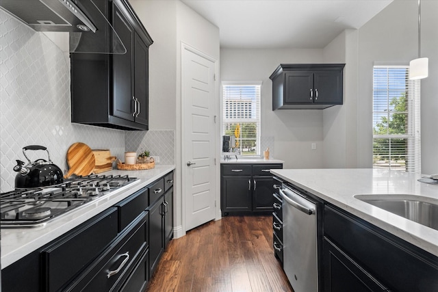 2451 S Gate Dr, Richardson, TX 75080 - kitchen featuring dark cabinetry, stainless steel appliances, healthy amount of natural light, and dark wood-style floors