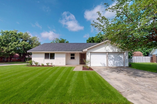 909 Dover Cir, Gainesville, TX 76240 - ranch-style house featuring a garage, concrete driveway, and roof with shingles