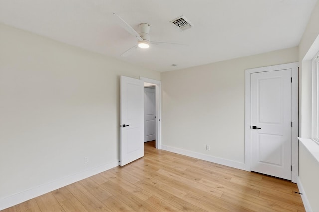 909 Dover Cir, Gainesville, TX 76240 - unfurnished bedroom featuring light wood-style floors, baseboards, and a ceiling fan