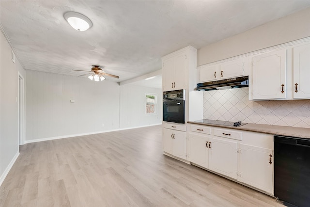 4543 Marigold Trl, Mesquite, TX 75150 - kitchen with black appliances, under cabinet range hood, ceiling fan, decorative backsplash, and light wood-style floors