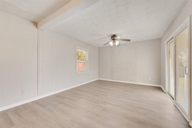4543 Marigold Trl, Mesquite, TX 75150 - spare room with a ceiling fan, light wood-type flooring, and beam ceiling