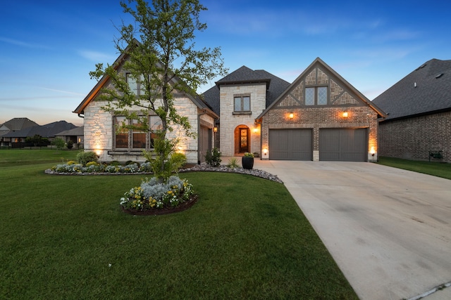 7800 Kentmere, The Colony, TX 75056 - french country style house with stone siding, concrete driveway, and a front yard