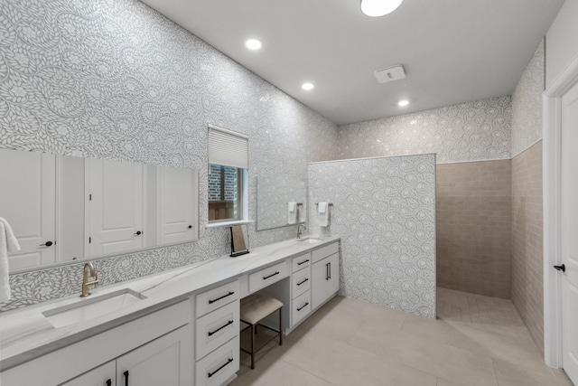 7800 Kentmere, The Colony, TX 75056 - bathroom featuring double vanity, walk in shower, tile patterned flooring, and recessed lighting
