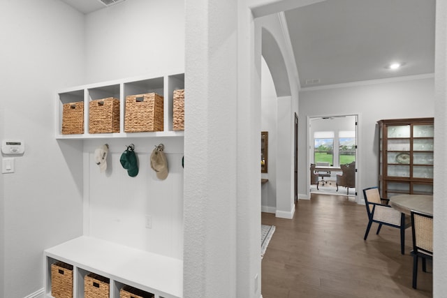 7800 Kentmere, The Colony, TX 75056 - mudroom featuring arched walkways, crown molding, wood finished floors, and baseboards