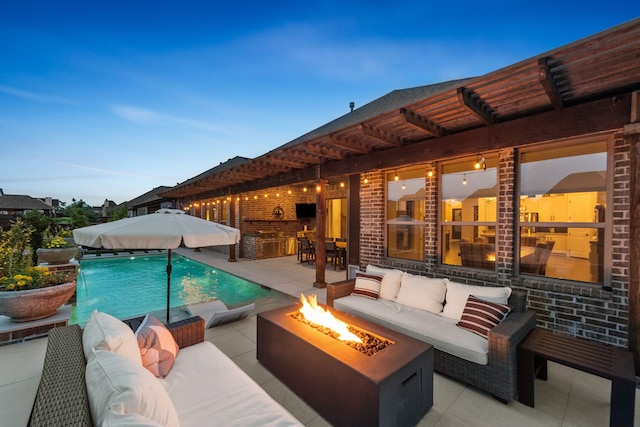 7800 Kentmere, The Colony, TX 75056 - swimming pool with an outdoor living space with a fire pit and a patio