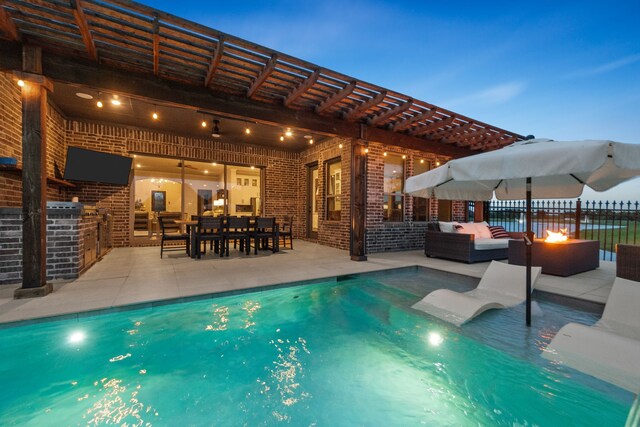 7800 Kentmere, The Colony, TX 75056 - view of swimming pool featuring an outdoor living space with a fire pit, a patio area, and outdoor dining space