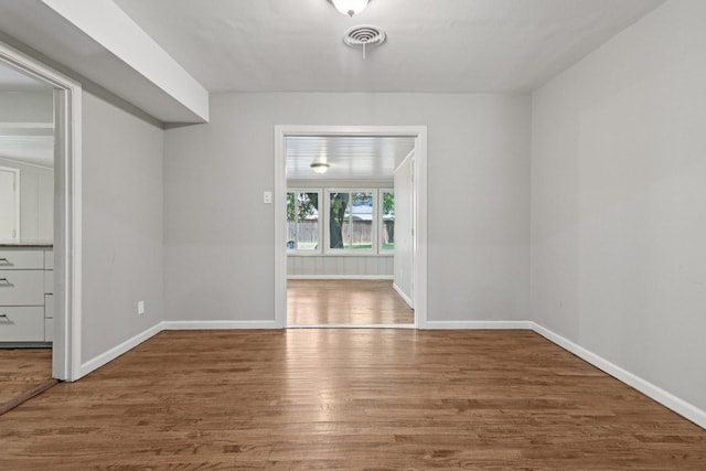 3620 W Biddison St, Fort Worth, TX 76109 - spare room featuring wood finished floors and baseboards