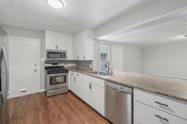 3620 W Biddison St, Fort Worth, TX 76109 - kitchen with stainless steel appliances, a sink, dark wood-type flooring, and light stone counters