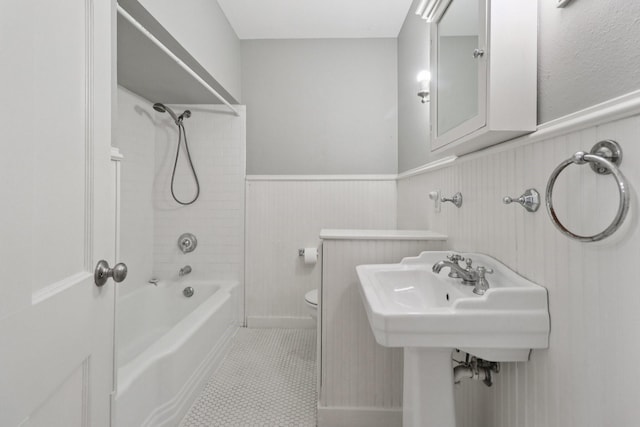 3620 W Biddison St, Fort Worth, TX 76109 - bathroom with shower / bath combination, a wainscoted wall, toilet, and tile patterned flooring