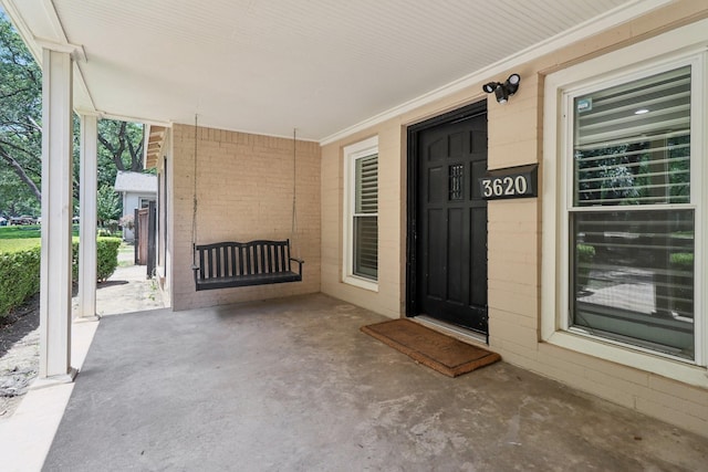 3620 W Biddison St, Fort Worth, TX 76109 - property entrance featuring covered porch and brick siding