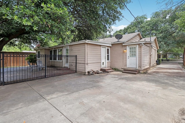 3620 W Biddison St, Fort Worth, TX 76109 - view of front facade featuring entry steps, driveway, a gate, and a patio area