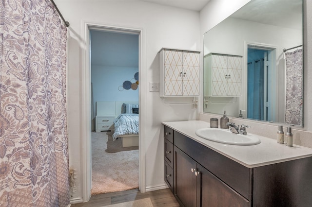 3113 Harper St, Little Elm, TX 75068 - ensuite bathroom with vanity and wood finished floors