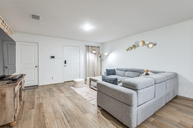 3113 Harper St, Little Elm, TX 75068 - living room featuring light wood finished floors and baseboards