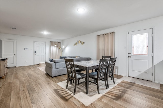 3113 Harper St, Little Elm, TX 75068 - dining area featuring light wood finished floors and baseboards