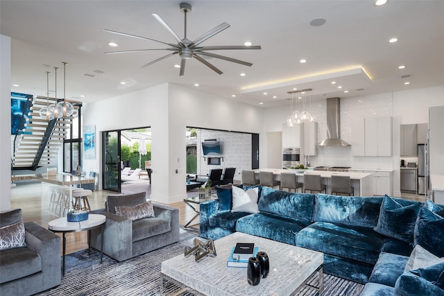 6420 Azalea Ln, Dallas, TX 75230 - living room with ceiling fan, recessed lighting, stairway, and light wood-type flooring