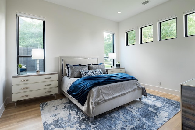 6420 Azalea Ln, Dallas, TX 75230 - bedroom with wood finished floors, multiple windows, baseboards, and recessed lighting