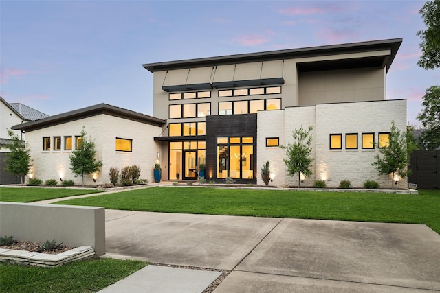 6420 Azalea Ln, Dallas, TX 75230 - back of property at dusk featuring a lawn