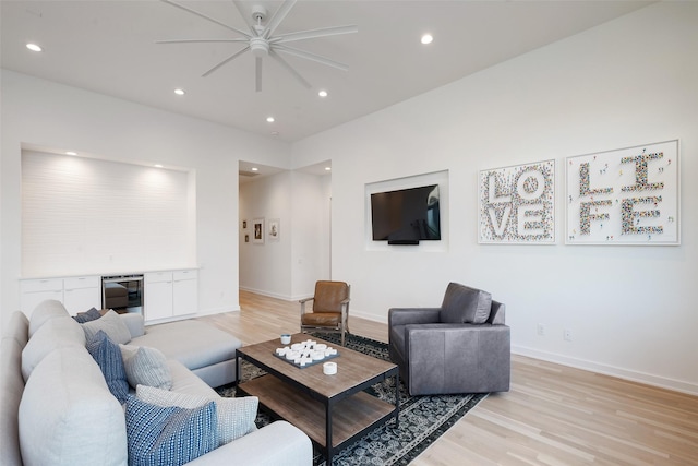 6420 Azalea Ln, Dallas, TX 75230 - living room with light wood-type flooring, ceiling fan, baseboards, recessed lighting, and a dry bar