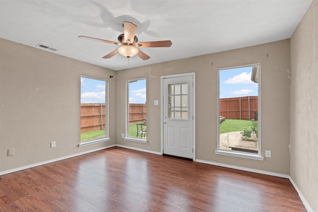 1100 Cedarcrest Dr, Mesquite, TX 75149 - unfurnished room with wood finished floors, a ceiling fan, and baseboards