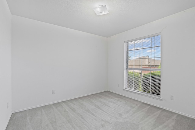1100 Cedarcrest Dr, Mesquite, TX 75149 - unfurnished room featuring carpet, baseboards, and a textured ceiling