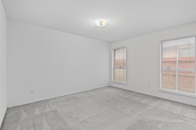 1100 Cedarcrest Dr, Mesquite, TX 75149 - carpeted empty room with healthy amount of natural light and baseboards