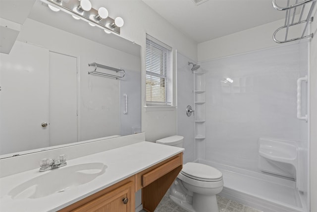 1100 Cedarcrest Dr, Mesquite, TX 75149 - full bathroom with a shower, vanity, and toilet