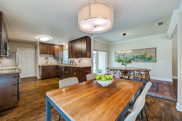 6616 Elvedon Dr, Dallas, TX 75248 - dining space with dark wood finished floors, baseboards, and ornamental molding