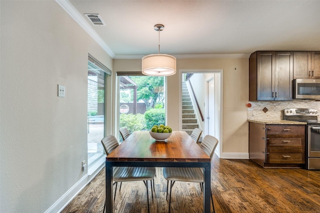 6616 Elvedon Dr, Dallas, TX 75248 - dining room featuring dark wood-type flooring, stairway, baseboards, and crown molding