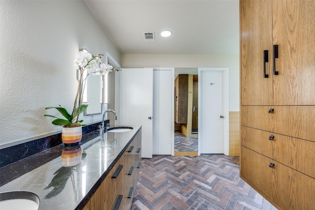 6616 Elvedon Dr, Dallas, TX 75248 - bathroom featuring double vanity, brick floors, and recessed lighting