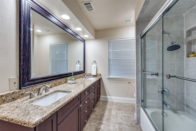 6616 Elvedon Dr, Dallas, TX 75248 - bathroom featuring recessed lighting, double vanity, combined bath / shower with glass door, and baseboards