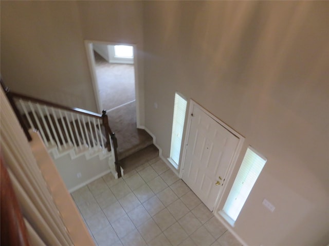 1501 Mountain Laurel Ln, Desoto, TX 75115 - entryway with stairs, light tile patterned flooring, and light carpet