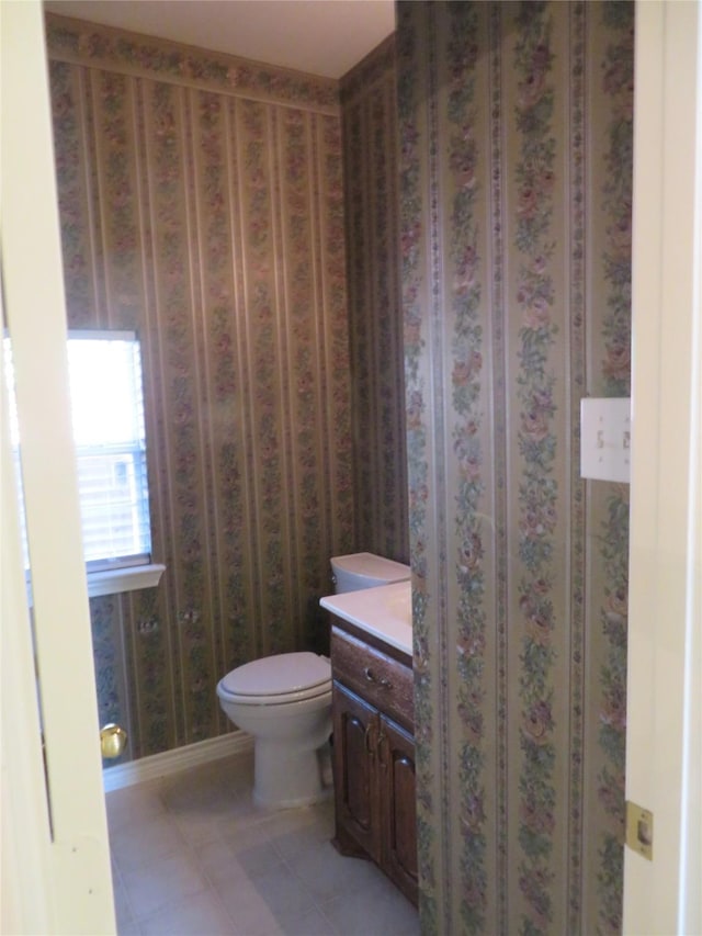 1501 Mountain Laurel Ln, Desoto, TX 75115 - bathroom featuring vanity, toilet, tile patterned flooring, and baseboards