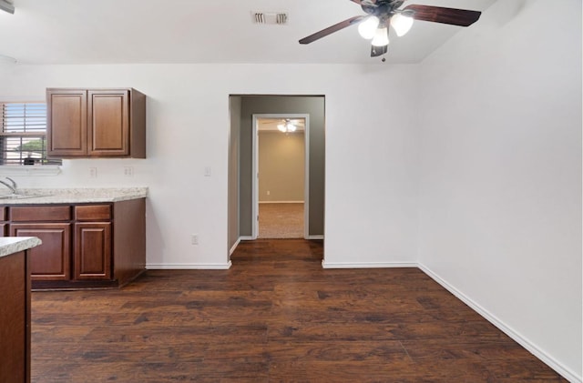 6650 Pine Mill Rd, Reno, TX 75462 - kitchen with a ceiling fan, baseboards, dark wood-type flooring, and a sink